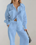 Partial sweater with pockets, polo collar and button closure Matching wide-leg trousers with pockets