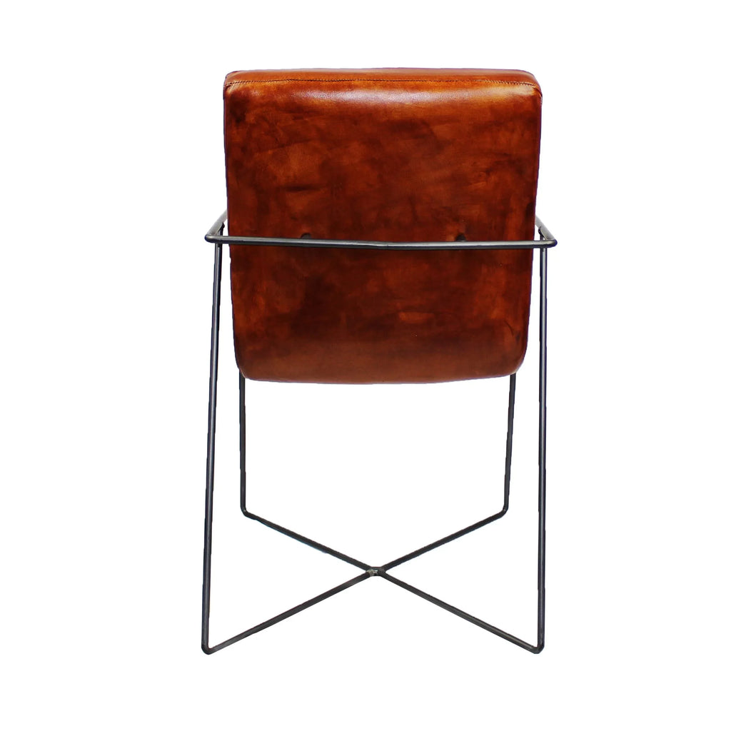 Sedia da pranzo Raoul in pelle di bufalo color cognac - base a croce con braccioli