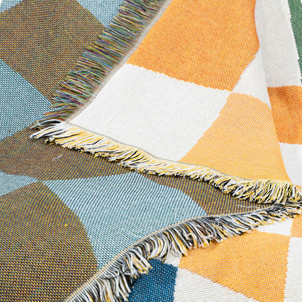 Coperta multifunzionale per divano con protezione antigraffio e design a scacchiera color block