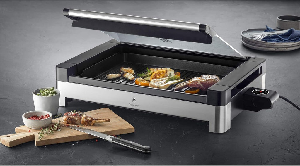 WMF Lono Barbecue elettrico da tavolo con coperchio in vetro, piastra rivestita, vaschetta raccogli-grasso rimovibile, lavabile in lavastoviglie, acciaio inox opaco, 2200 Watt