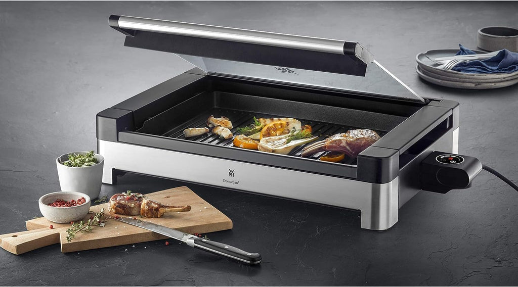 WMF Lono Barbecue elettrico da tavolo con coperchio in vetro, piastra rivestita, vaschetta raccogli-grasso rimovibile, lavabile in lavastoviglie, acciaio inox opaco, 2200 Watt